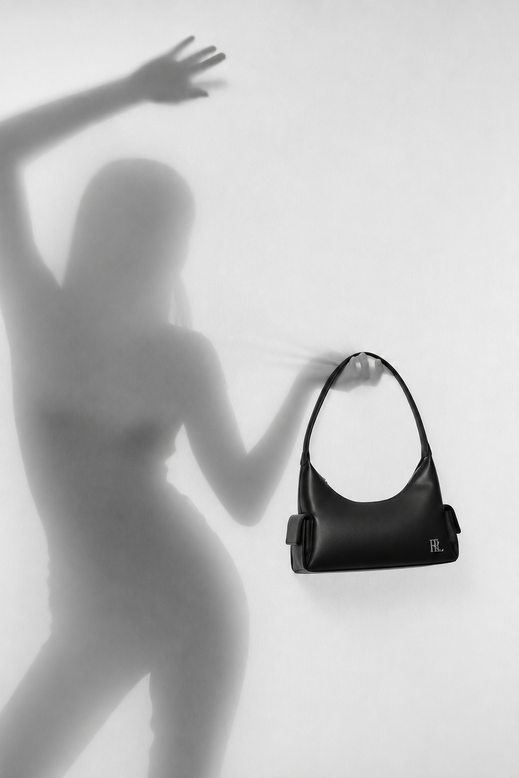 RLYN campaign handbag in a black and white studio scene